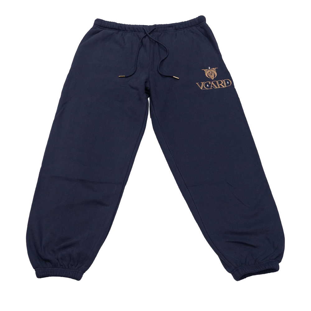 Navy sweatpants with gold embroidered VCard logo and gold-tipped drawstring on soft fabric.